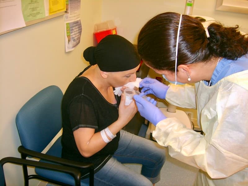 Professional nurse caring for elderly patient